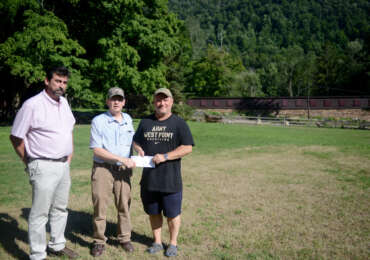 Tim Clark and Dave Zartman present a check to the Vets in the Valley Foundation