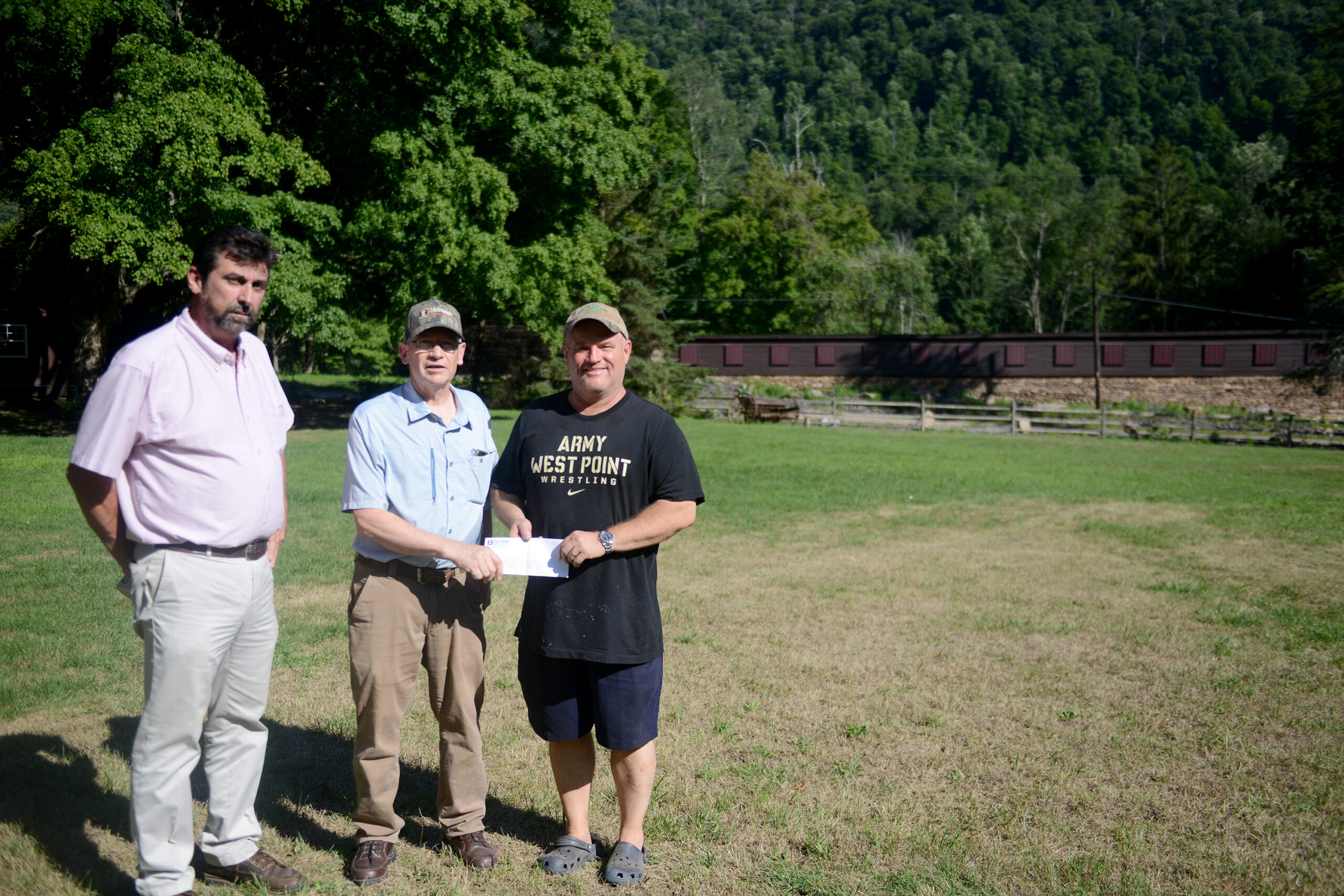 Tim Clark and Dave Zartman present a check to the Vets in the Valley Foundation