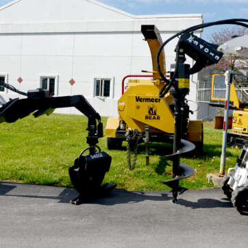 MT100 with log grapple and auger.